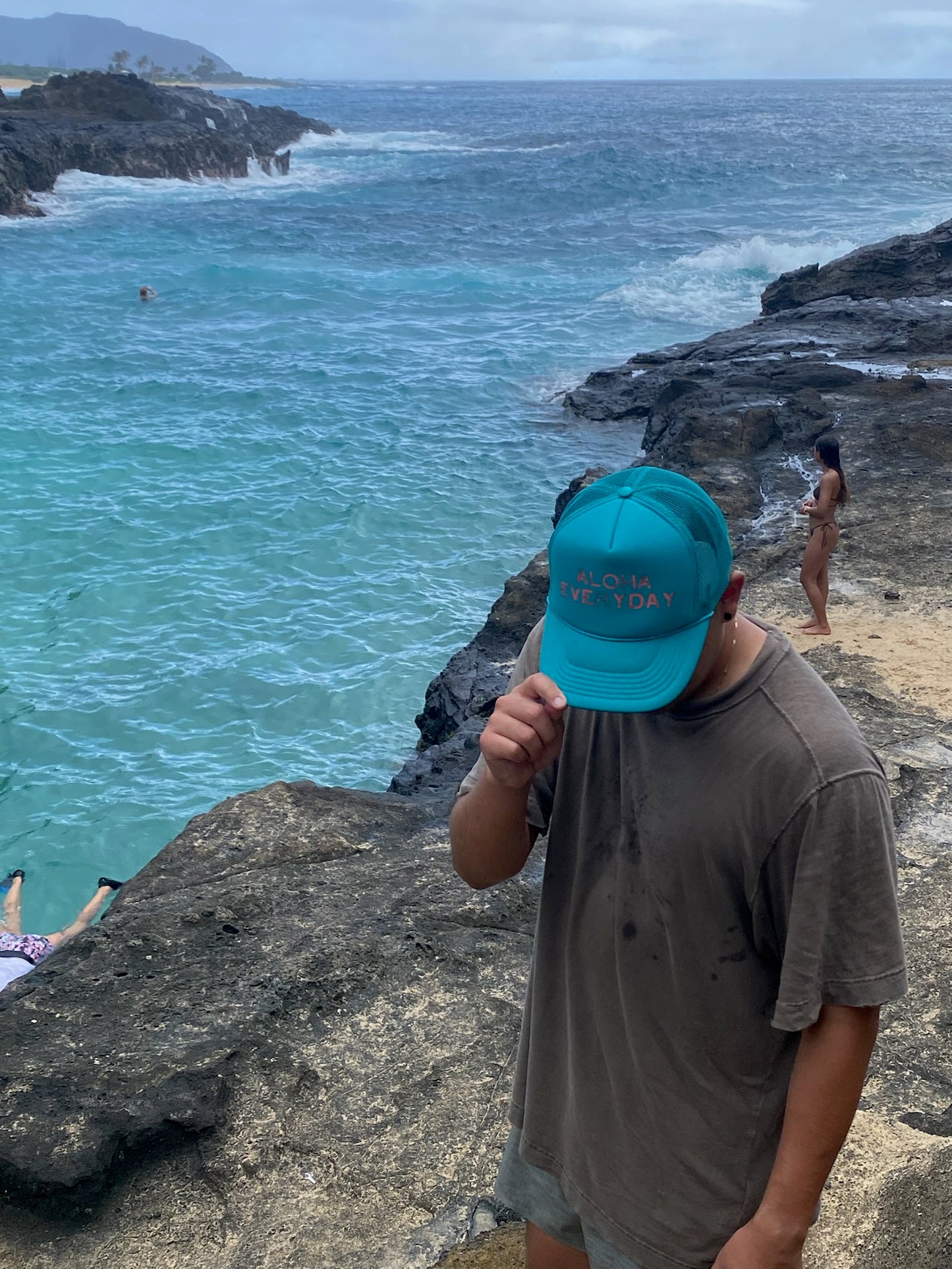 Beach style trucker hat in teal with pink Aloha Everyday print