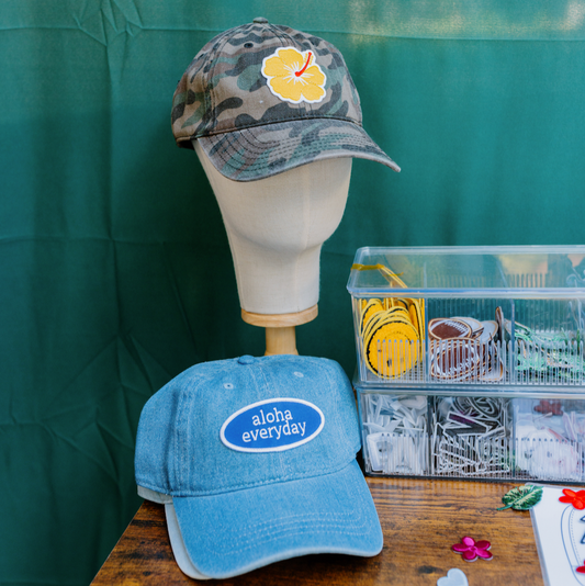 "Custom yellow hibiscus patch on camouflage baseball cap for women, dark green adjustable dad hat made from 100% cotton."