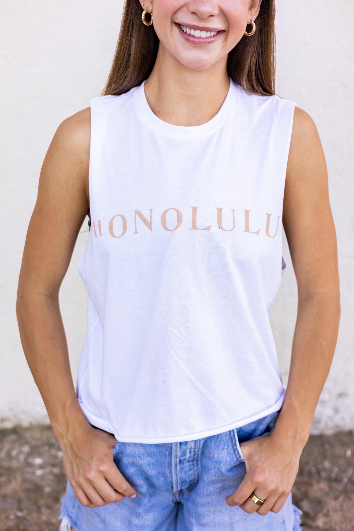 This tank is made with organic cotton. Featuring a hand stamped lettering unique to each tee. This tank is completely plant based and safe on your skin and our planet. This tank comes pre-cut at the hem for the perfect length, hitting right at your waistline. For ultimate comfort and added softness this tank gets better with each wear.  Hand Stamped  Slightly Cropped - Perfect for high-waisted bottoms, also can be tucked in  Raw Hemline, Relaxed Fit  Model is wearing size medium